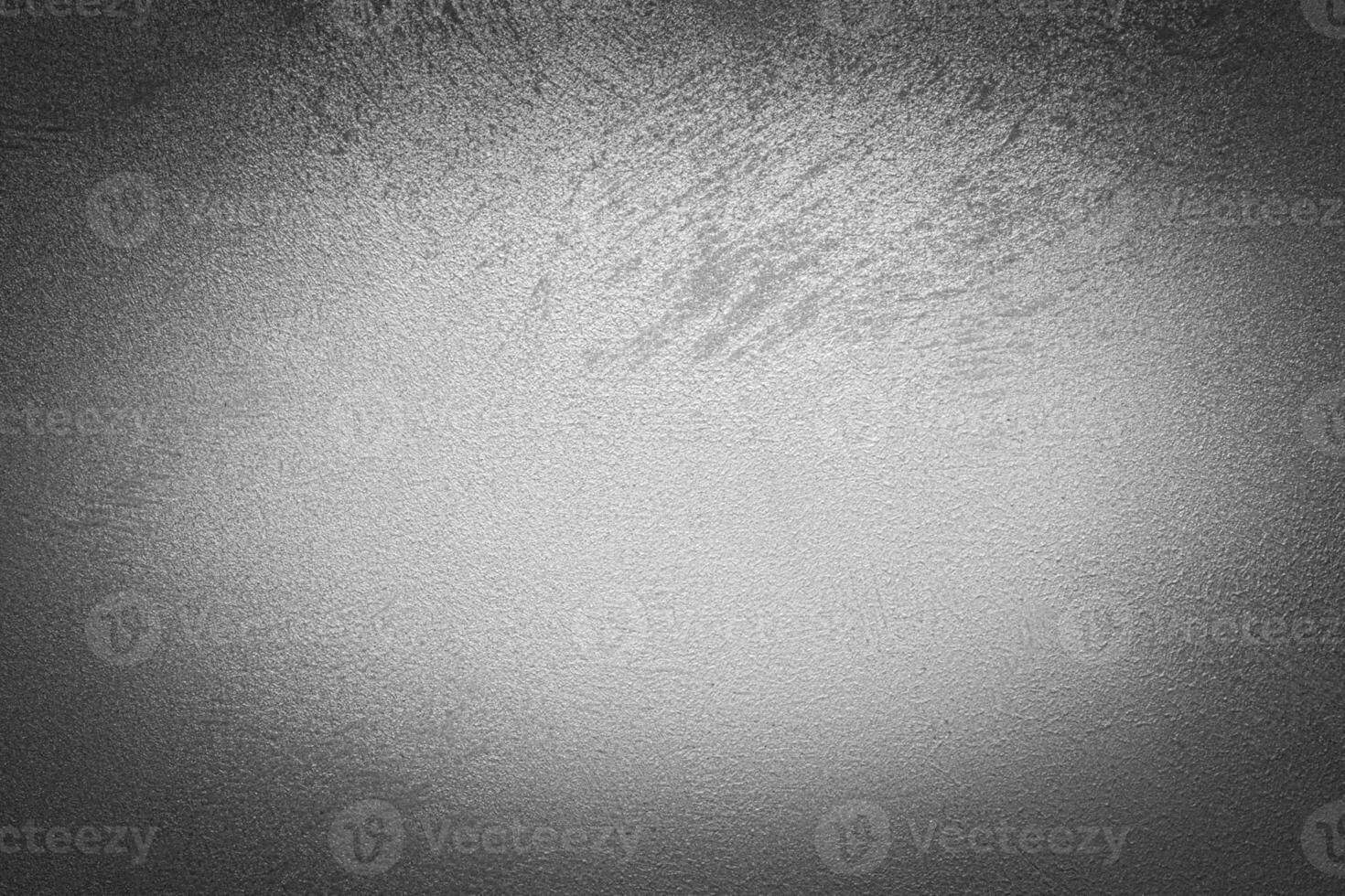 Gray decorative plaster texture with vignette. Abstract grunge background with copy space. photo