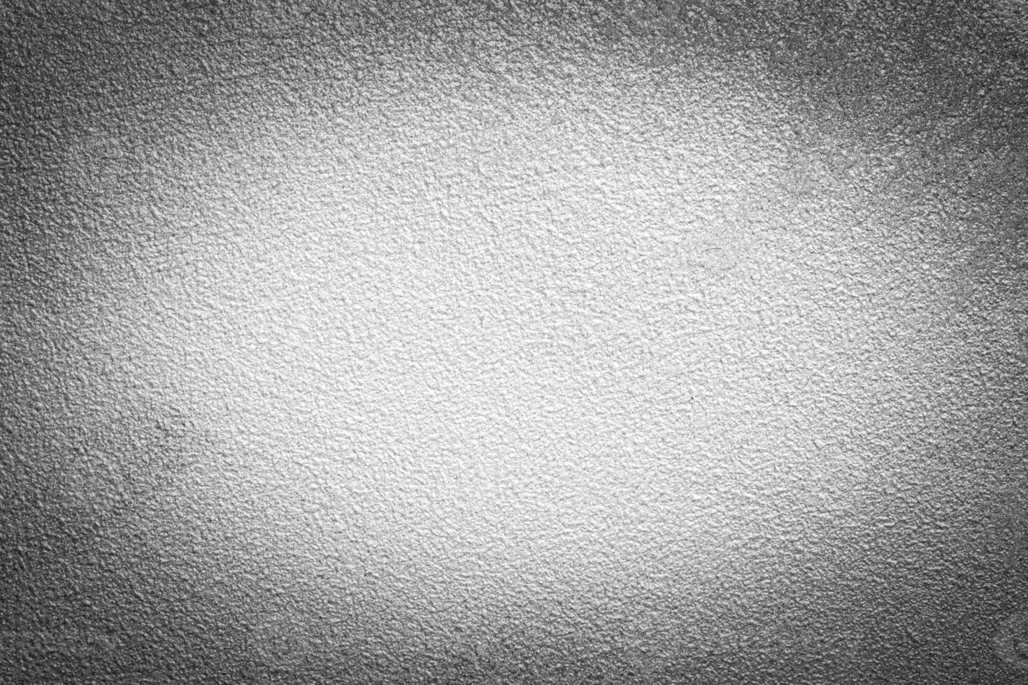 Gray decorative plaster texture with vignette. Abstract grunge background with copy space. photo