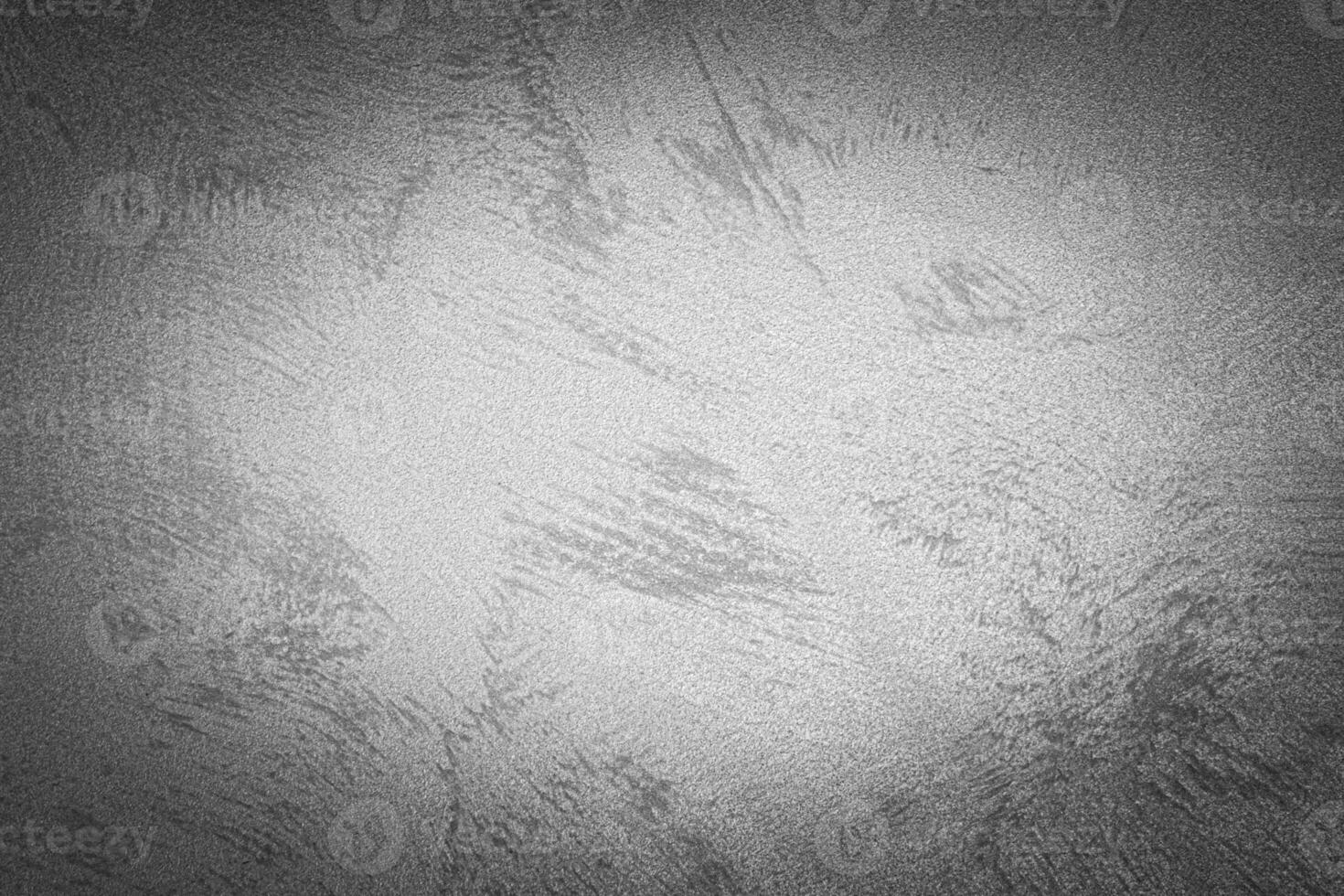Gray decorative plaster texture with vignette. Abstract grunge background with copy space. photo