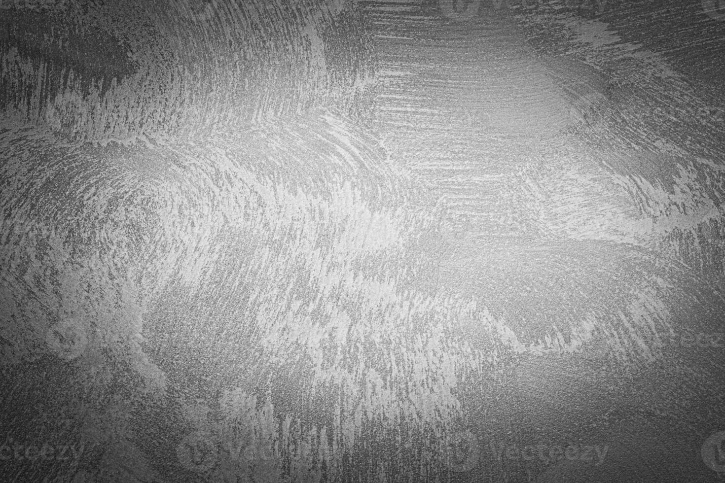 Gray decorative plaster texture with vignette. Abstract grunge background with copy space. photo