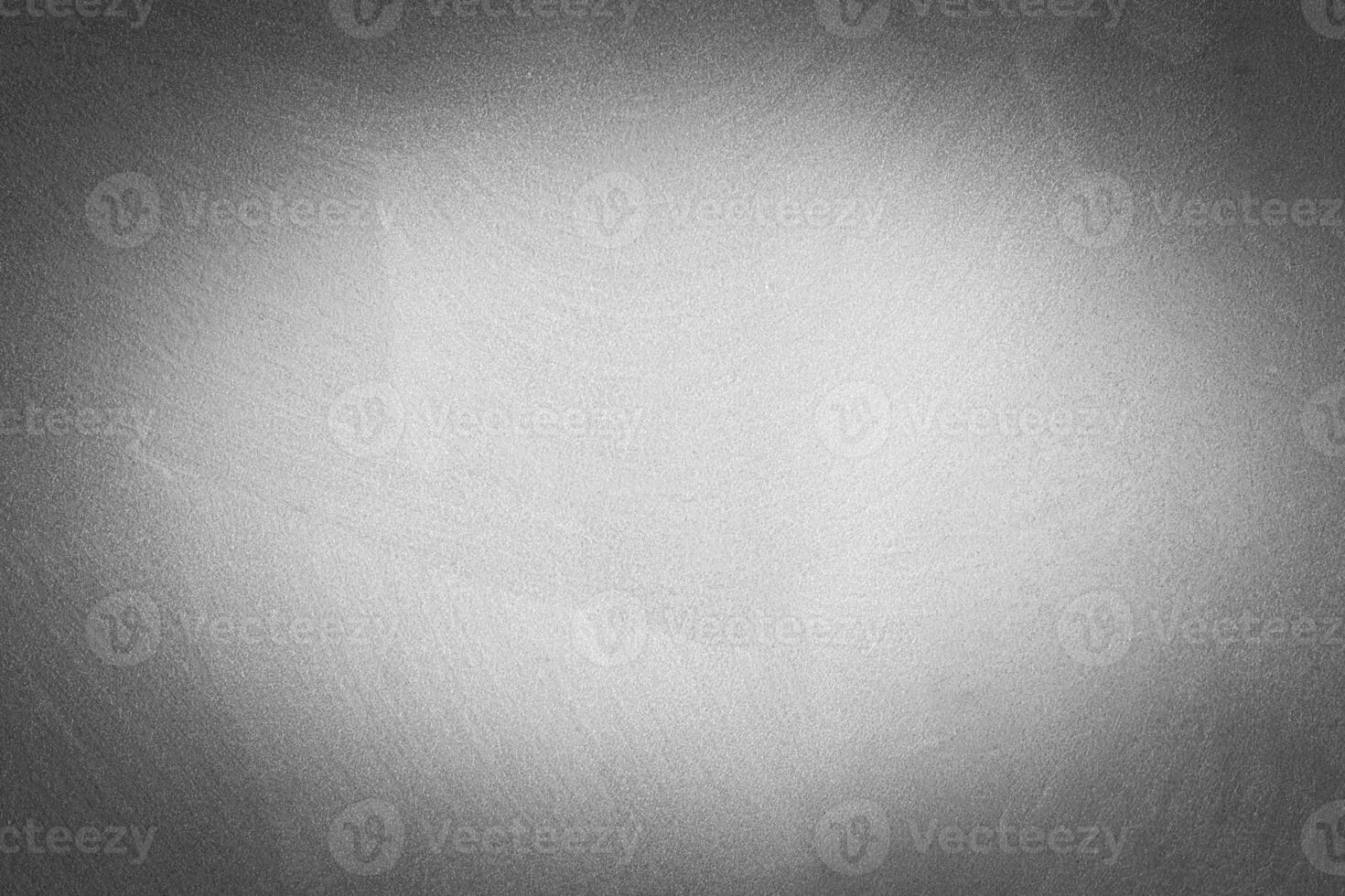 Gray decorative plaster texture with vignette. Abstract grunge background with copy space. photo
