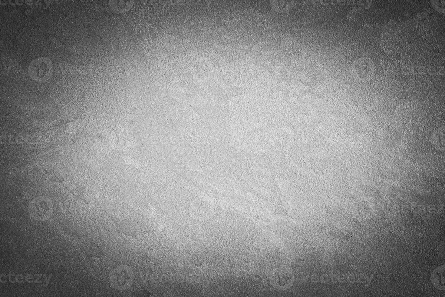 Gray decorative plaster texture with vignette. Abstract grunge background with copy space. photo