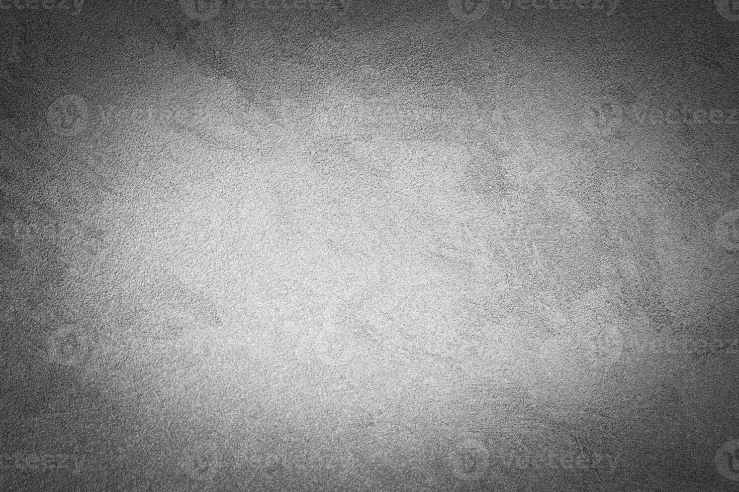 Gray decorative plaster texture with vignette. Abstract grunge background with copy space. photo