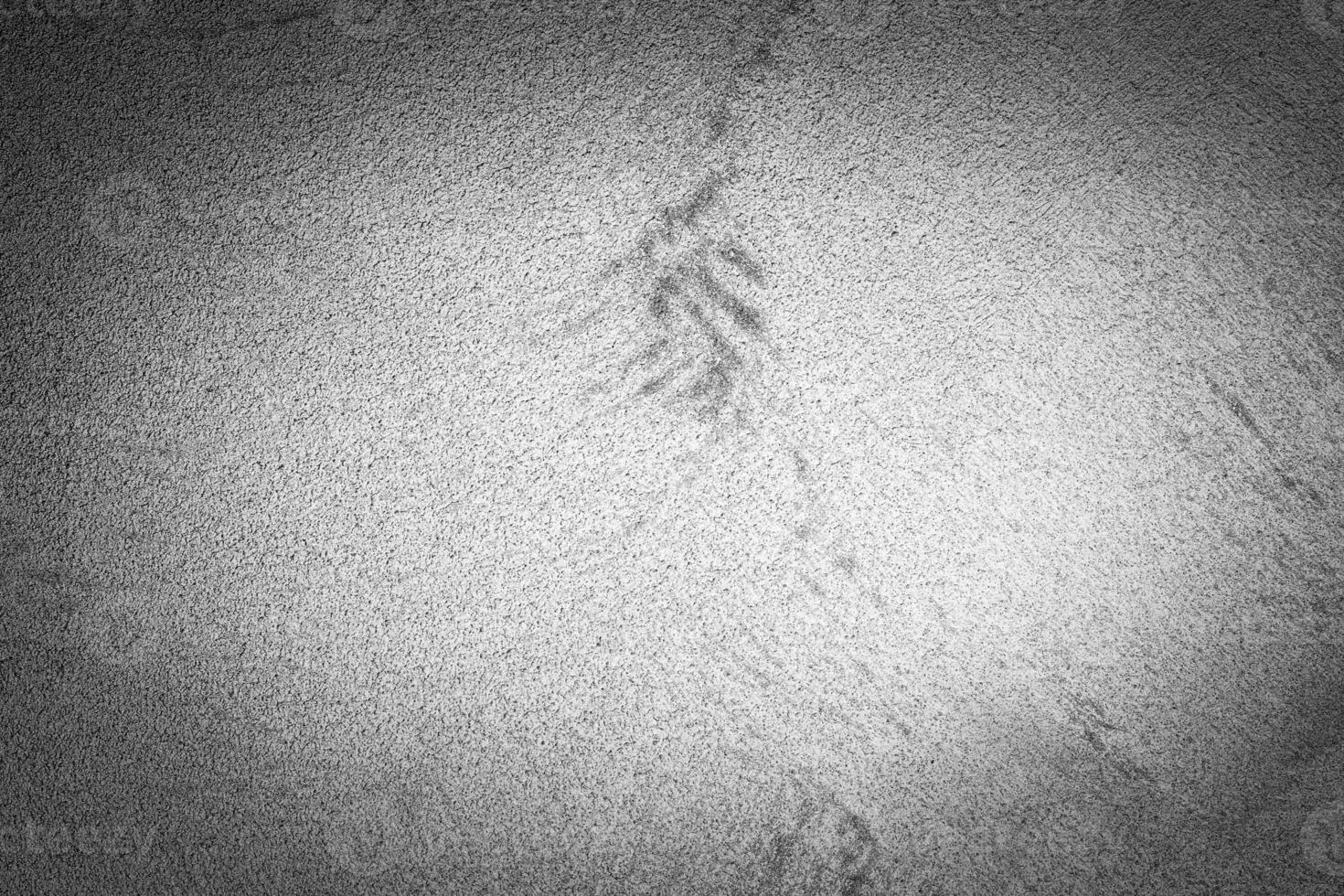 Gray decorative plaster texture with vignette. Abstract grunge background with copy space. photo