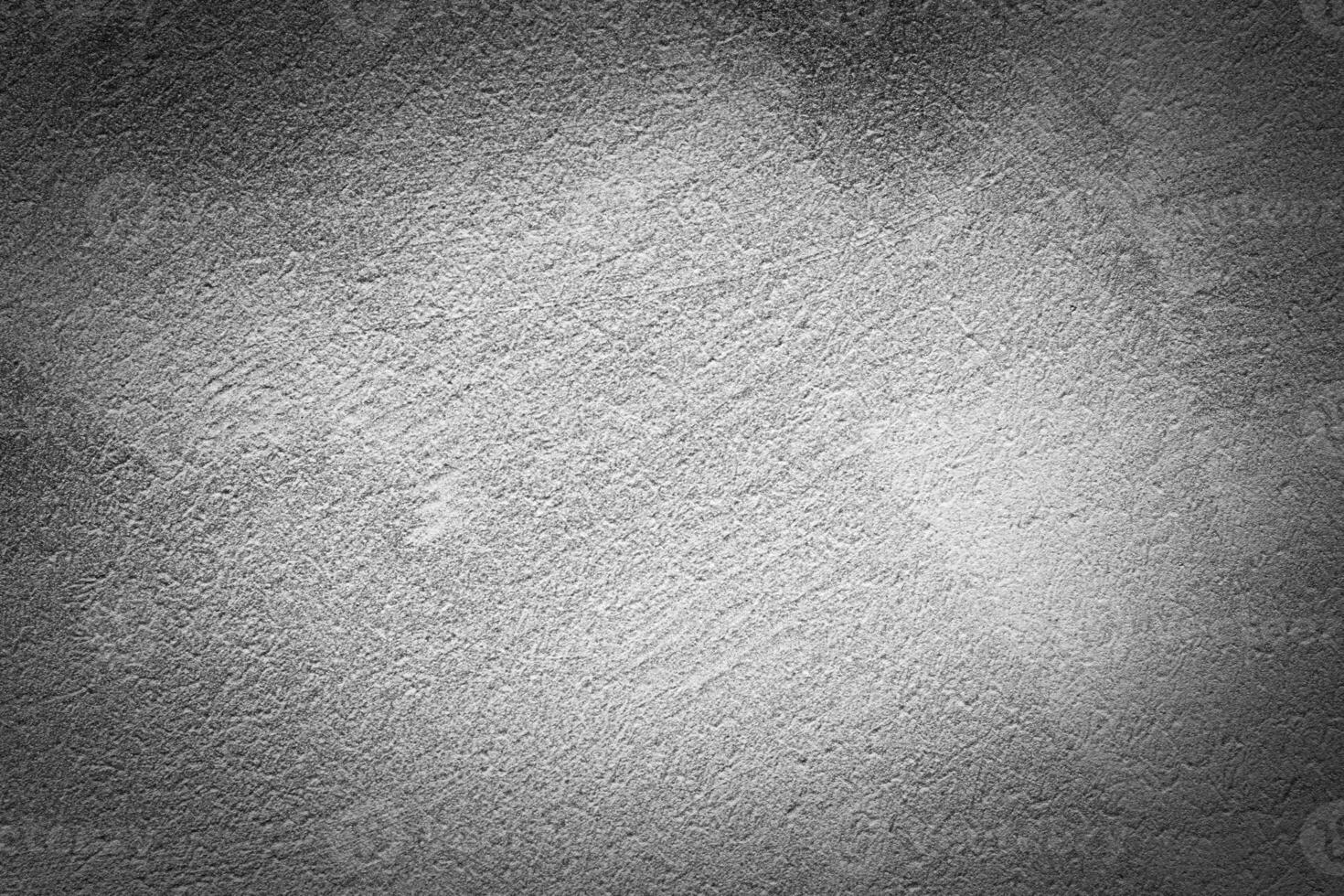 Gray decorative plaster texture with vignette. Abstract grunge background with copy space. photo