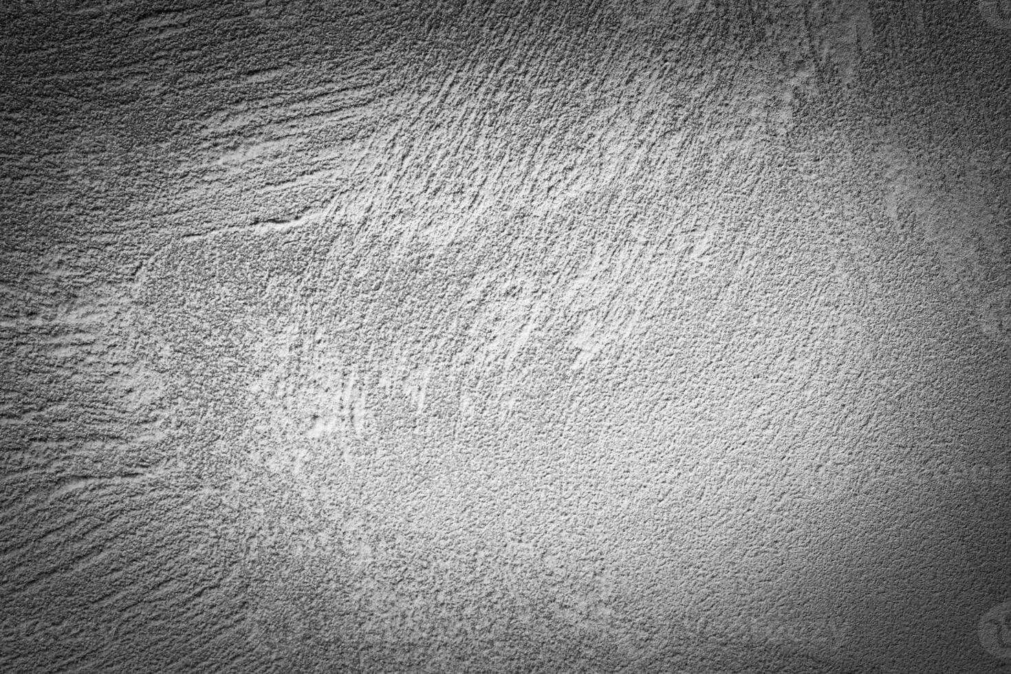Gray decorative plaster texture with vignette. Abstract grunge background with copy space. photo