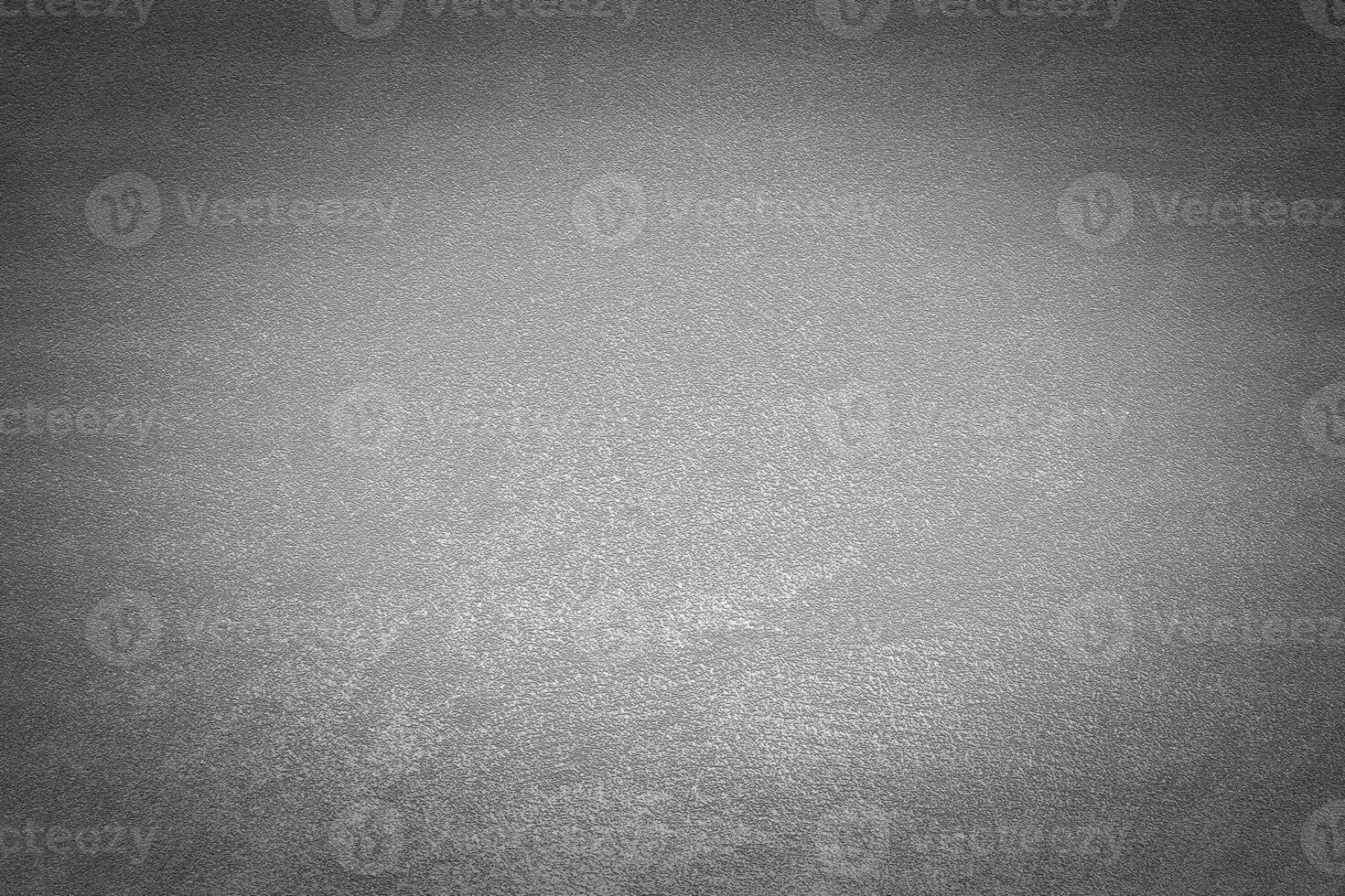 Gray decorative plaster texture with vignette. Abstract grunge background with copy space. photo