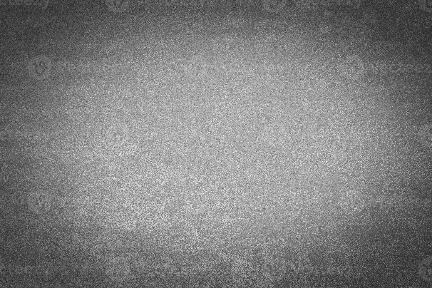 Gray decorative plaster texture with vignette. Abstract grunge background with copy space. photo