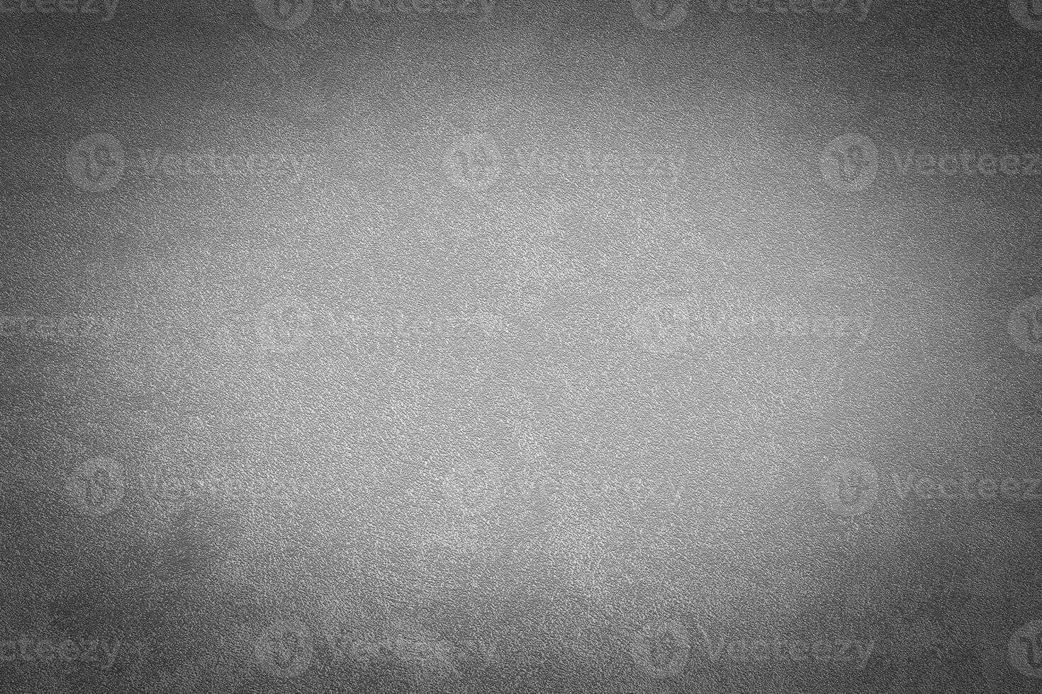 Gray decorative plaster texture with vignette. Abstract grunge background with copy space. photo