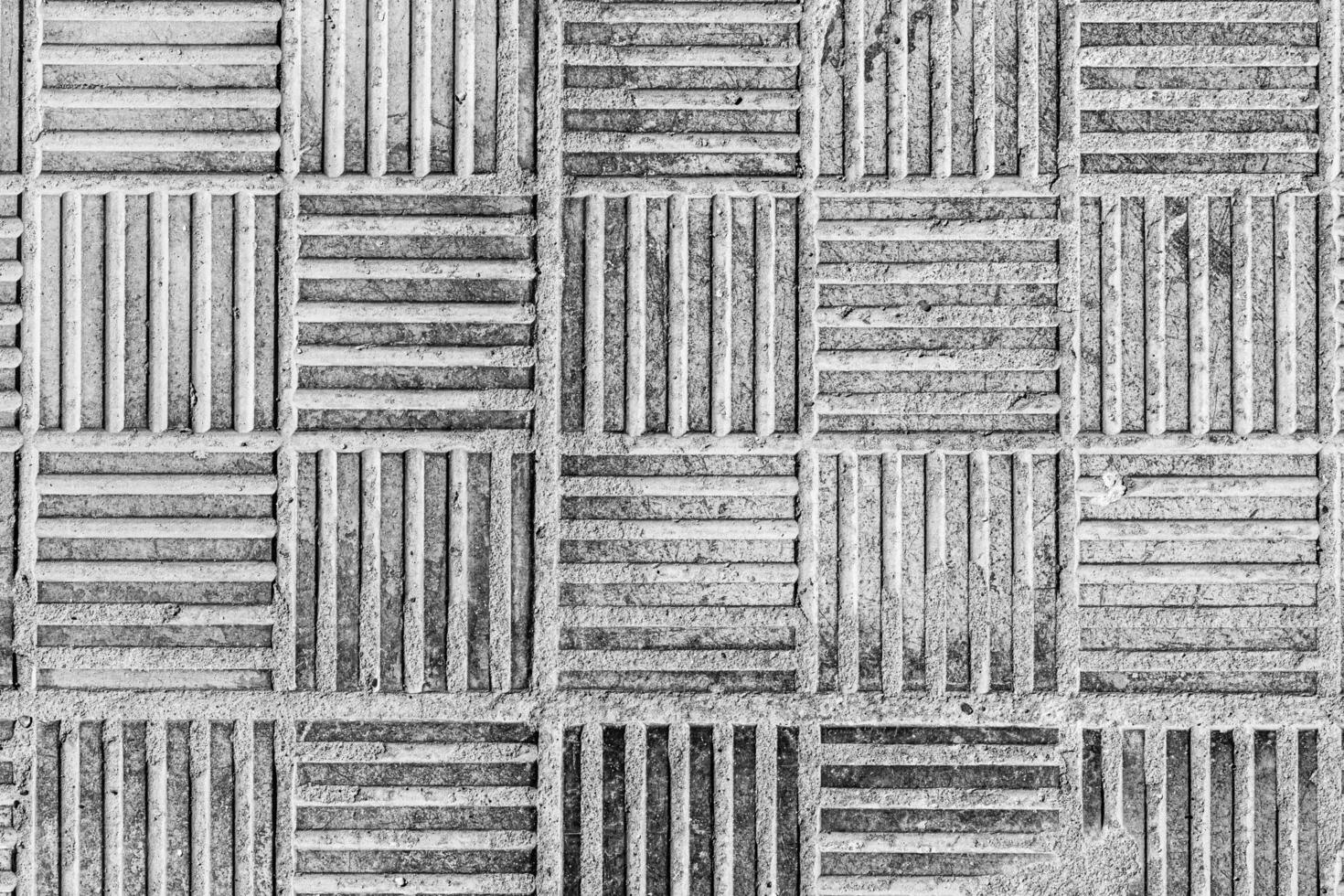 Top view on paving stone road. Old pavement of concrete texture. Cobblestone sidewalk. Black and white abstract background for design. photo
