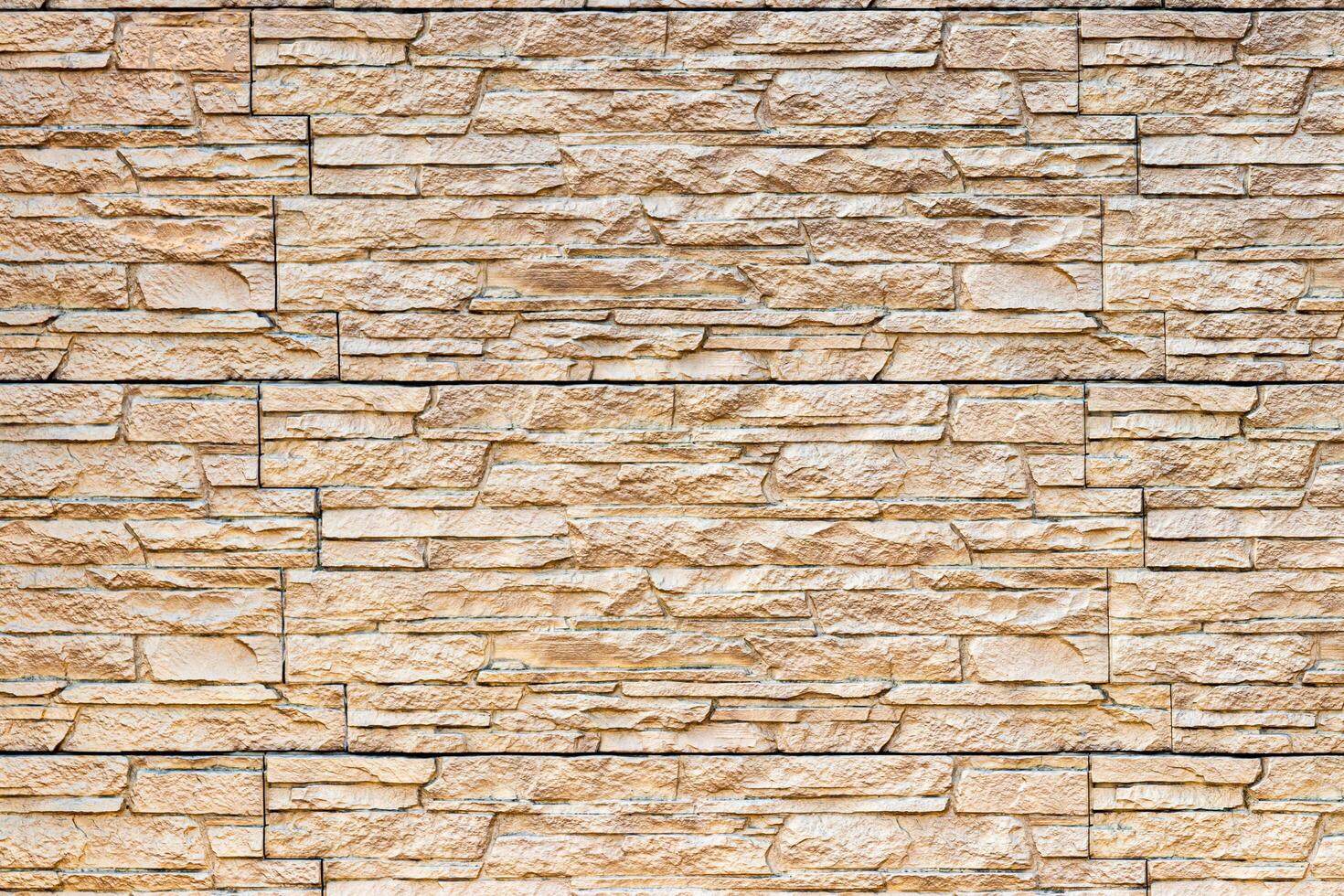 Texture of a wall covered with decorative brick-like tiles. Abstract background for design. photo