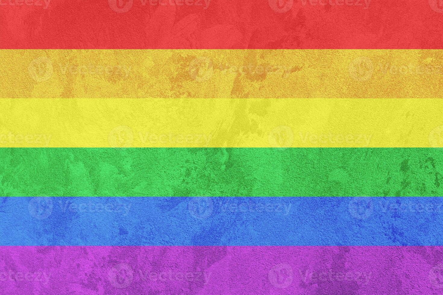 Rainbow LGBTQ or gay pride flag on decorative plaster or concrete texture. Abstract background. photo