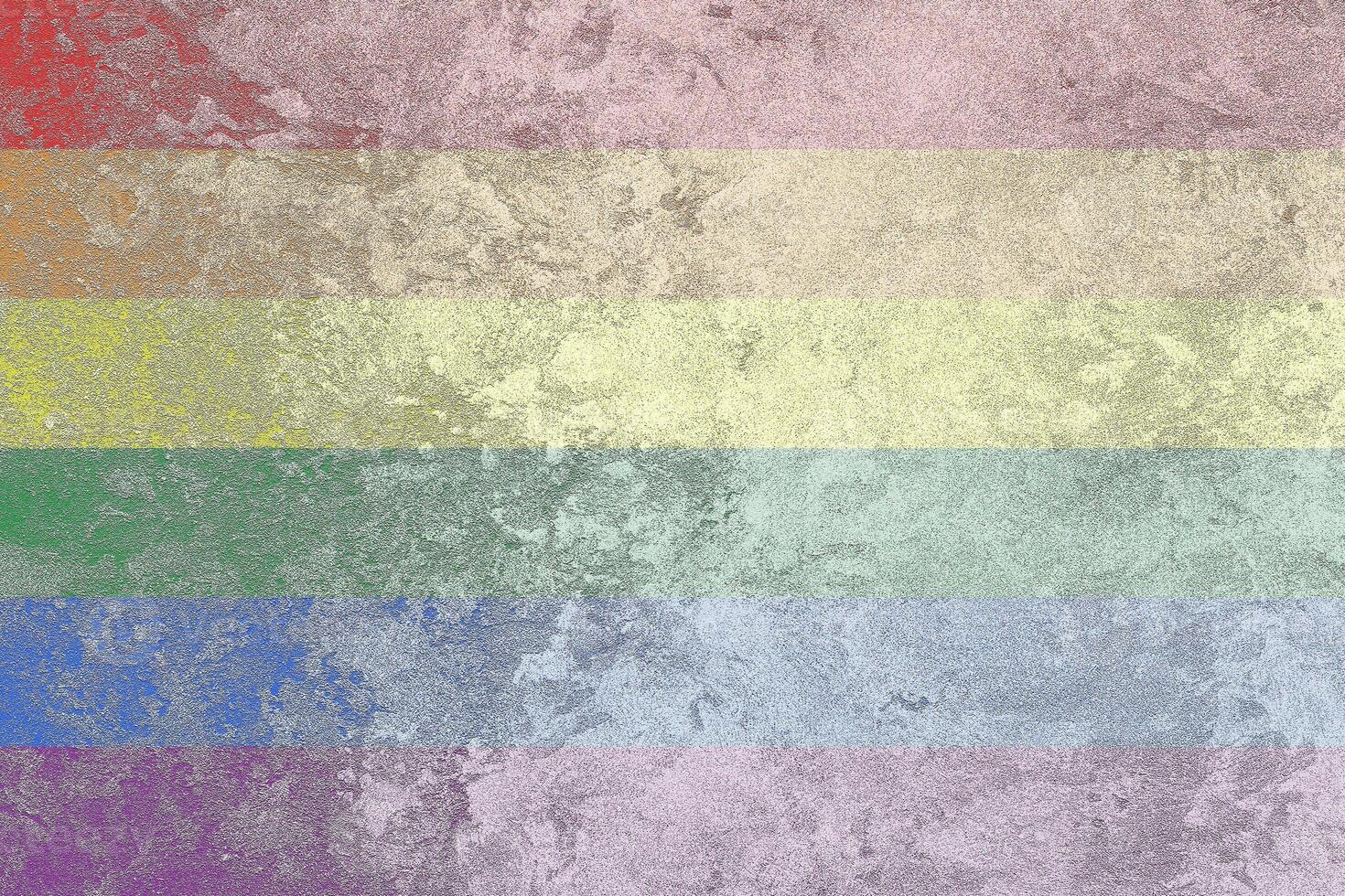 Rainbow LGBTQ or gay pride flag on decorative plaster or concrete texture. Abstract background. photo