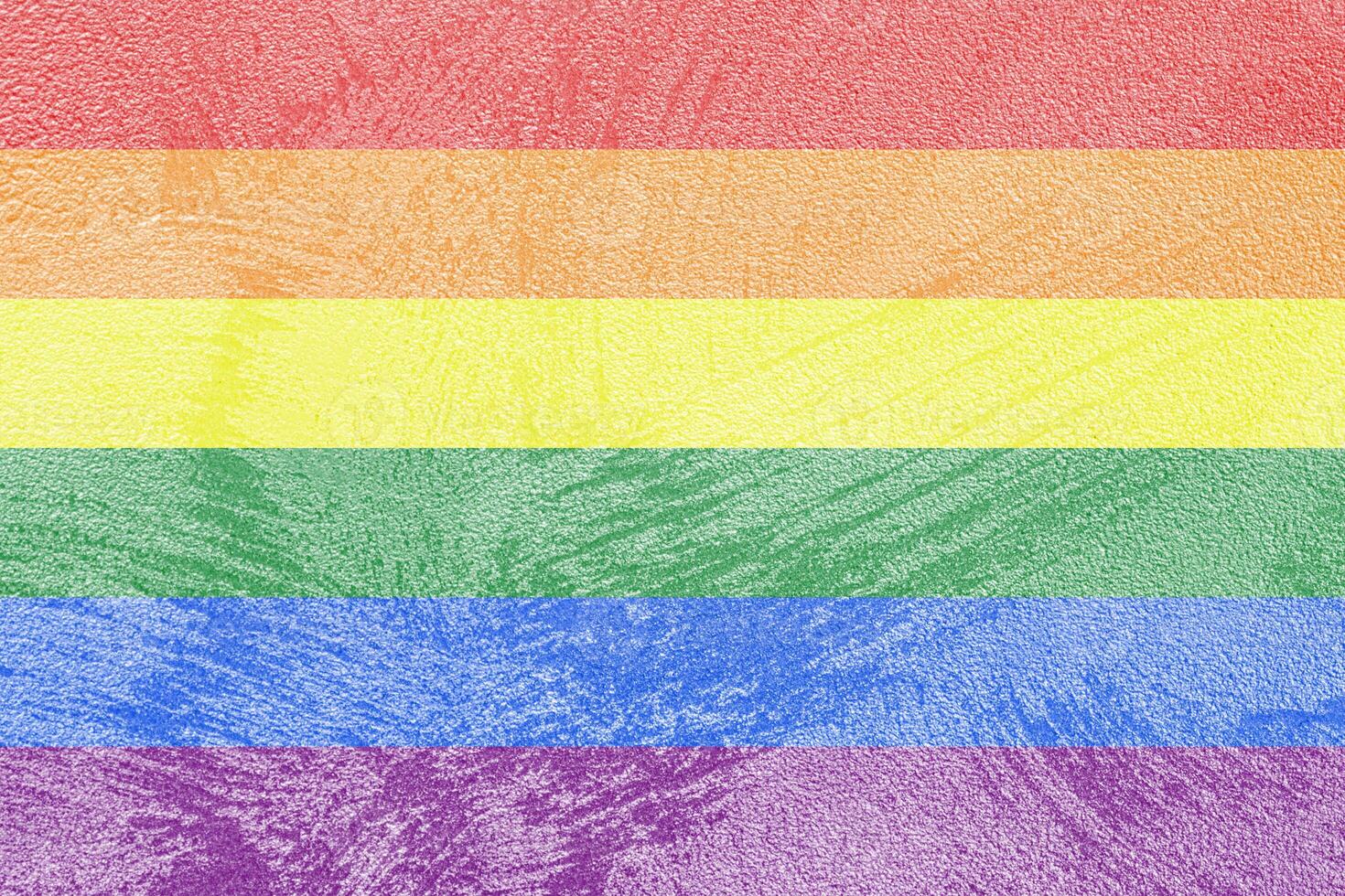 Rainbow LGBTQ or gay pride flag on decorative plaster or concrete texture. Abstract background. photo