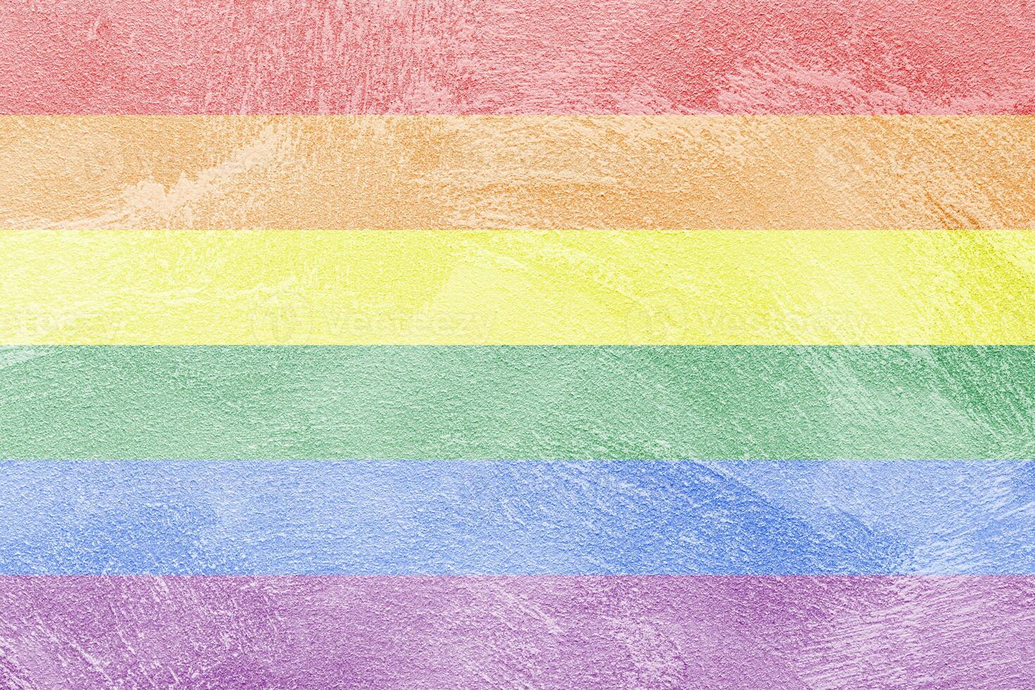 Rainbow LGBTQ or gay pride flag on decorative plaster or concrete texture. Abstract background. photo