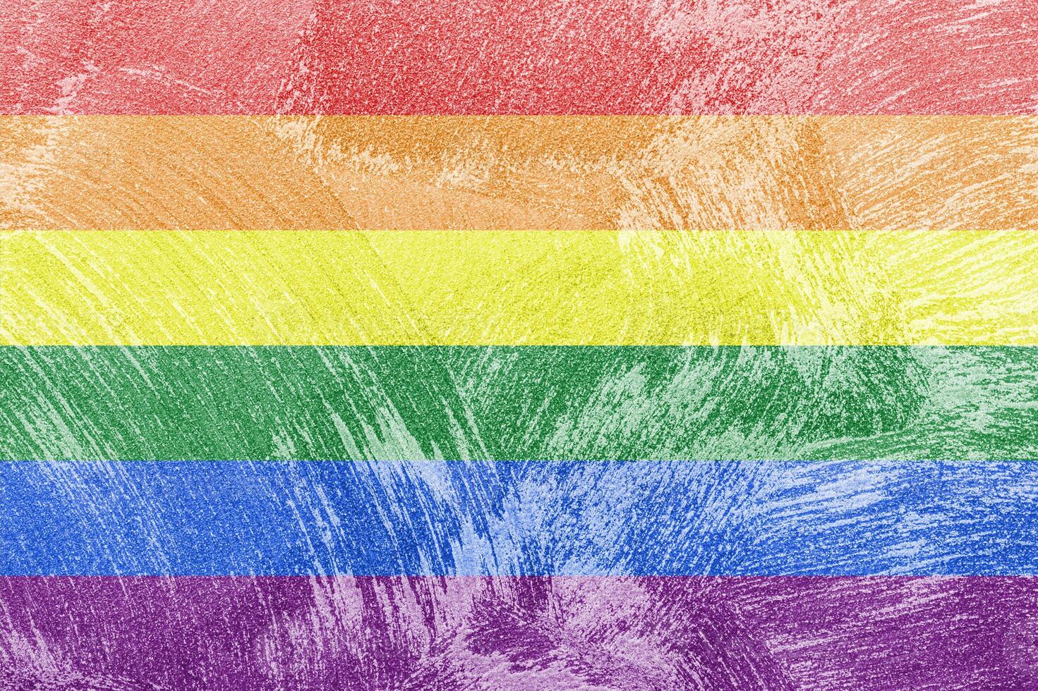 Rainbow LGBTQ or gay pride flag on decorative plaster or concrete texture. Abstract background. photo