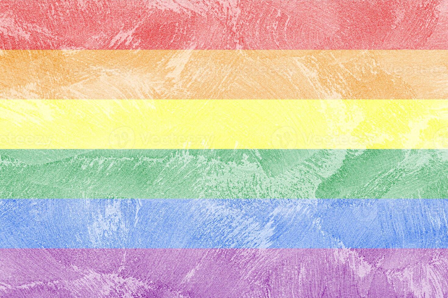 Rainbow LGBTQ or gay pride flag on decorative plaster or concrete texture. Abstract background. photo