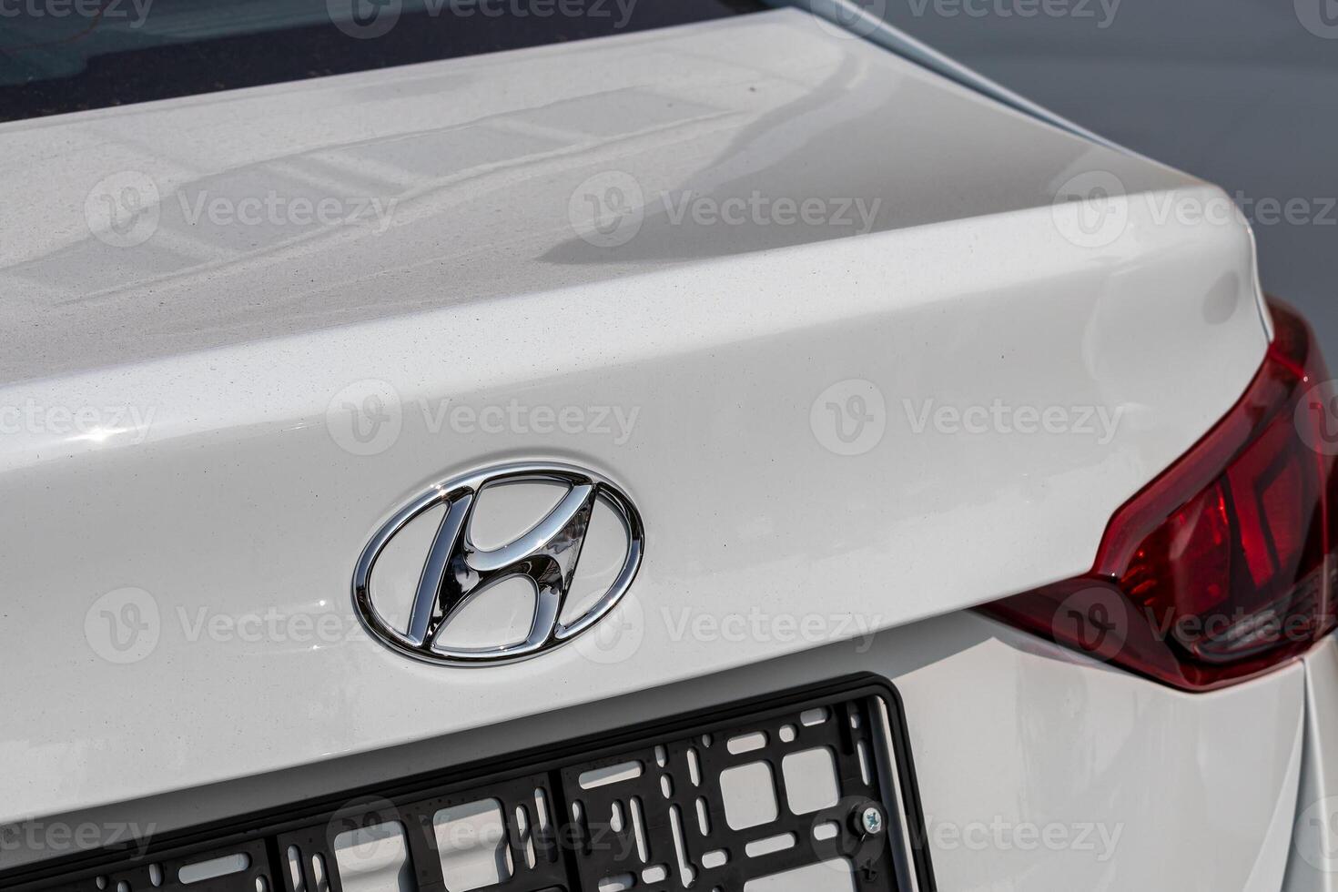 Russia, Kaluga - SEPTEMBER 29, 2020 Chrome-plated Hyundai logo on the trunk of a new car. photo