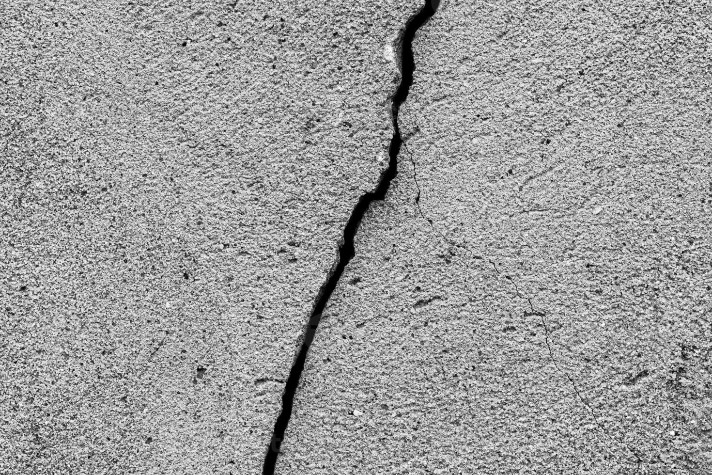 Black and white texture of cracked concrete wall or cement. photo