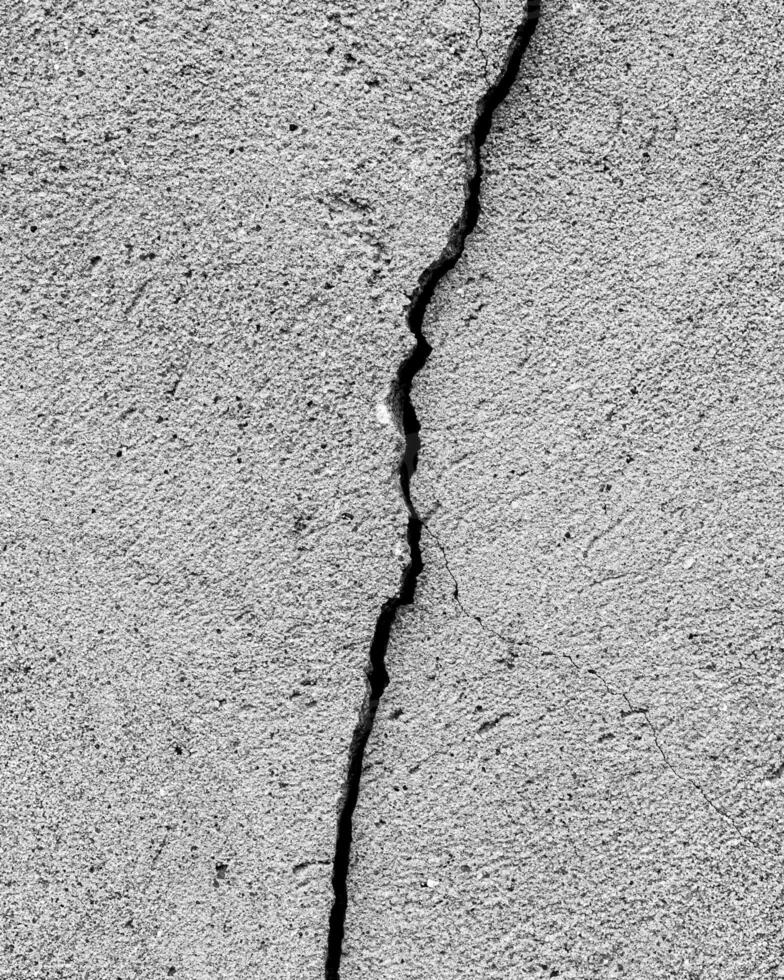 Black and white texture of cracked concrete wall or cement. photo