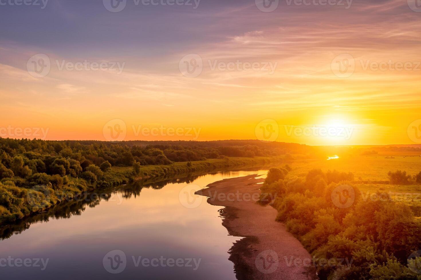 Sunset on the river at summer evening with clouds and trees. Water reflection of a sky. photo