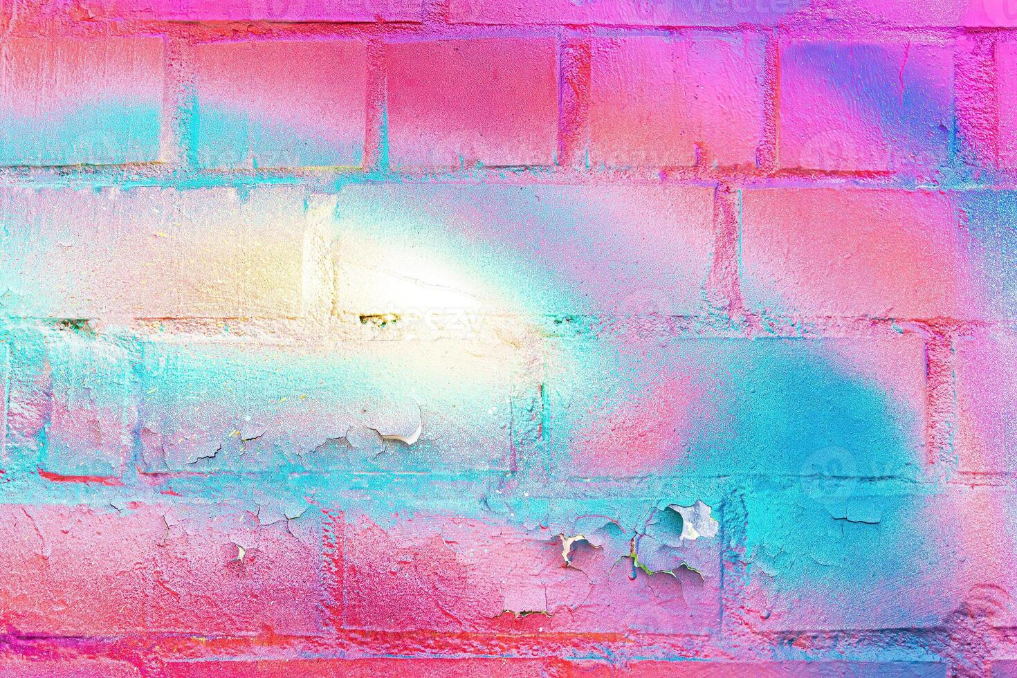 A fragment of colorful graffiti painted on a wall. Abstract urban background. photo