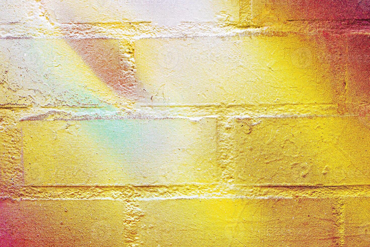 A fragment of colorful graffiti painted on a wall. Abstract urban background. photo