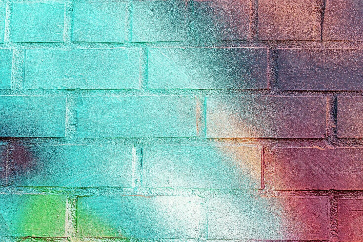 A fragment of colorful graffiti painted on a wall. Abstract urban background. photo