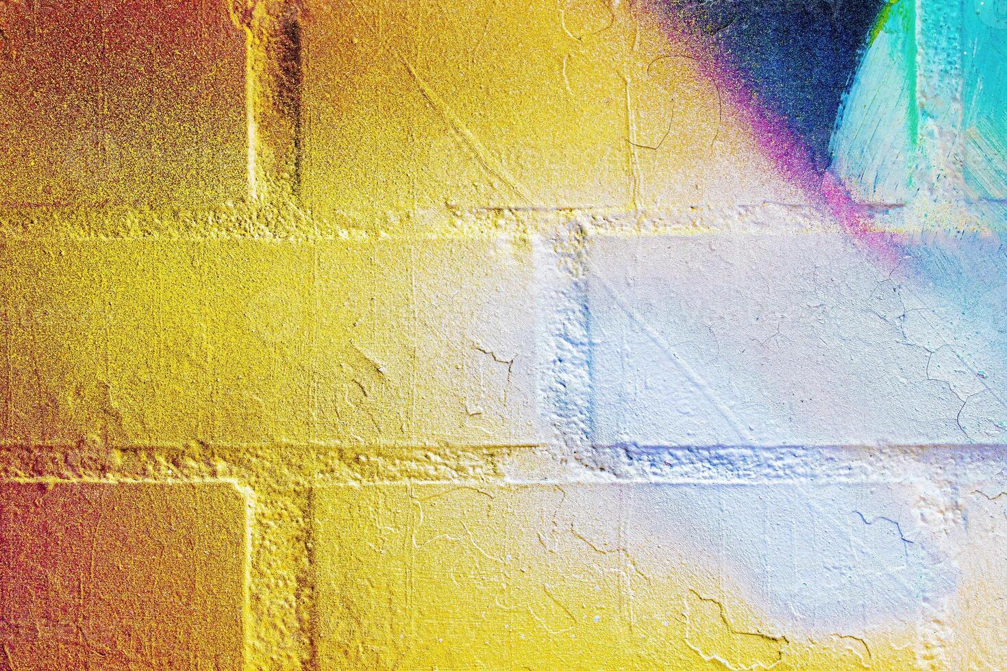A fragment of colorful graffiti painted on a wall. Abstract urban background. photo