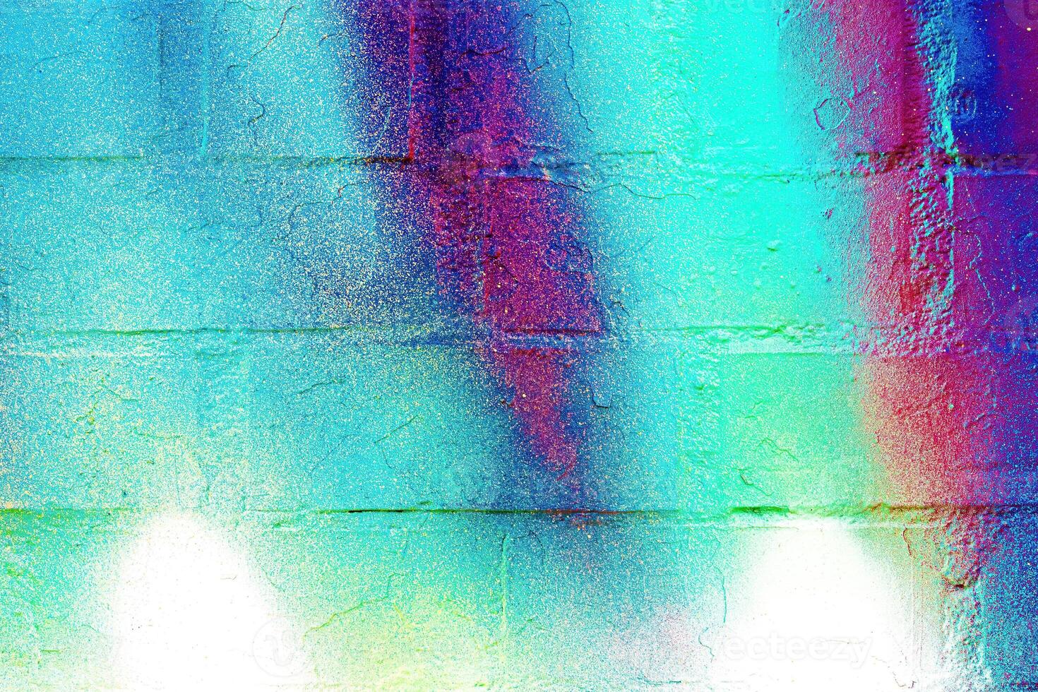 A fragment of colorful graffiti painted on a wall. Abstract urban background. photo