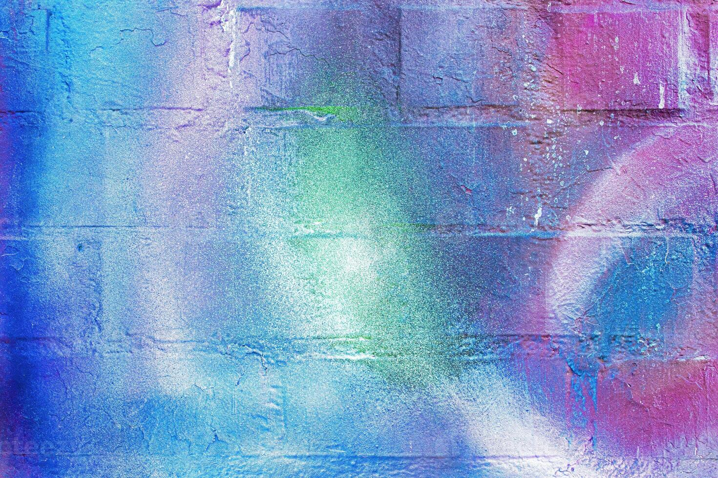 A fragment of colorful graffiti painted on a wall. Abstract urban background. photo