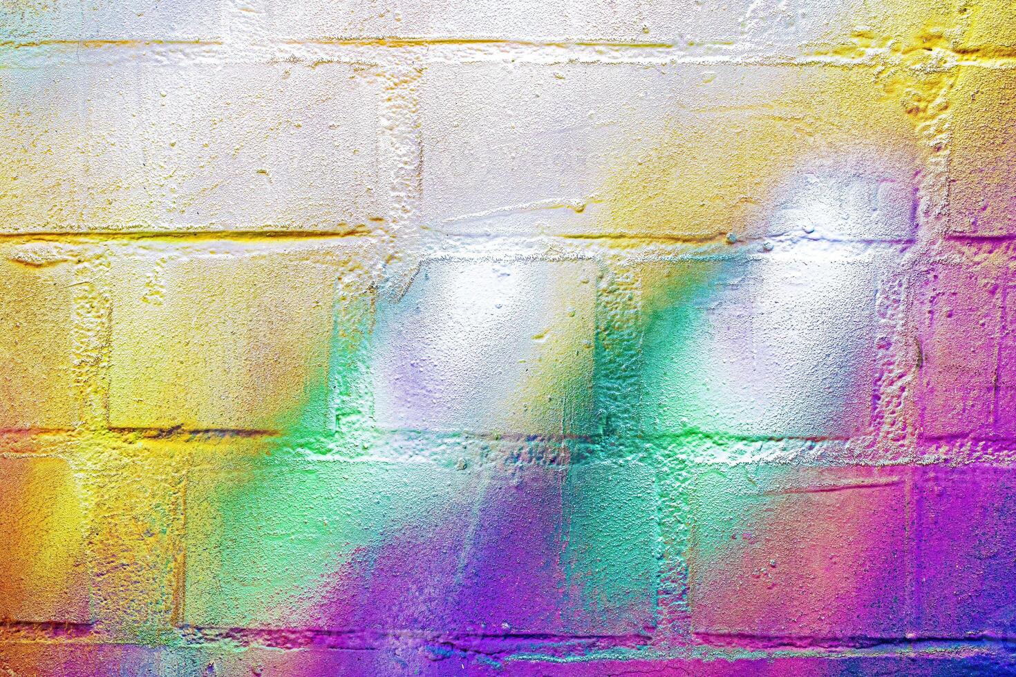 A fragment of colorful graffiti painted on a wall. Abstract urban background. photo