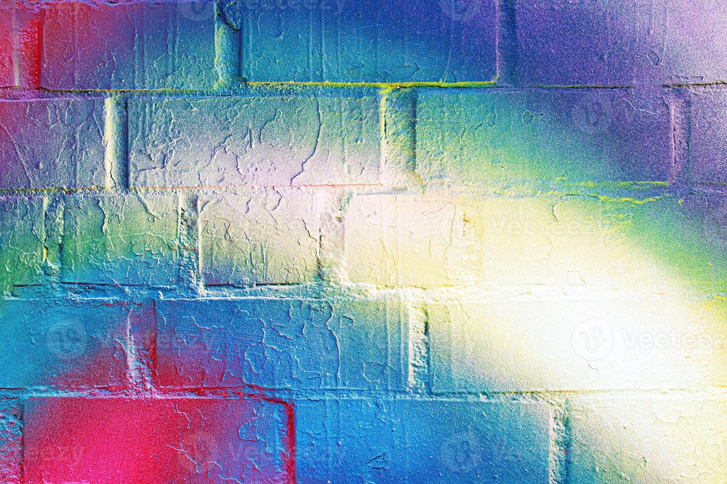 A fragment of colorful graffiti painted on a wall. Abstract urban background. photo