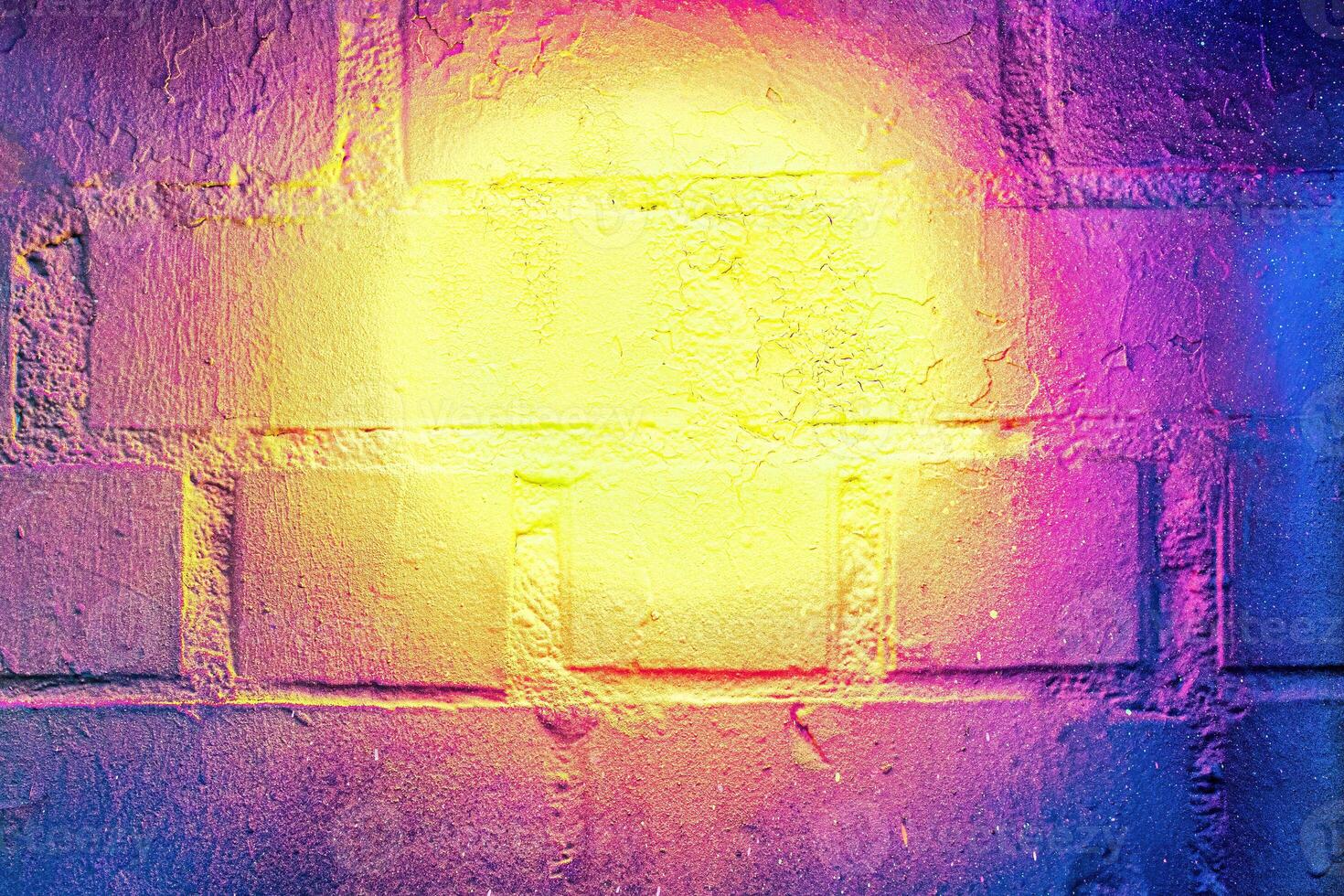 A fragment of colorful graffiti painted on a wall. Abstract urban background. photo