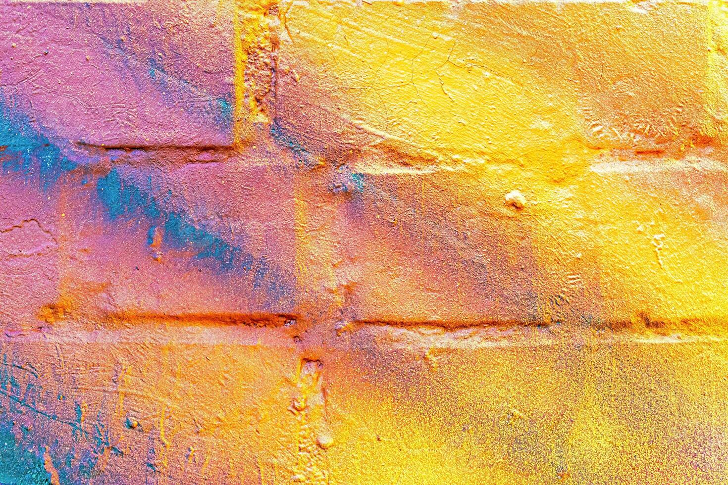 A fragment of colorful graffiti painted on a wall. Abstract urban background. photo