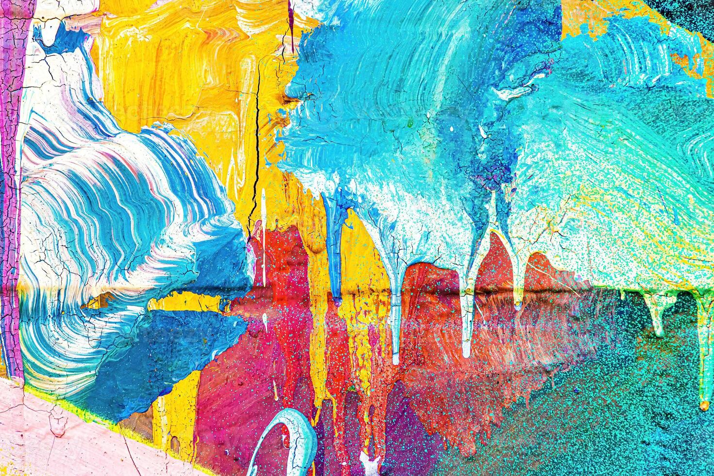 A fragment of colorful graffiti painted on a wall. Abstract urban background. photo
