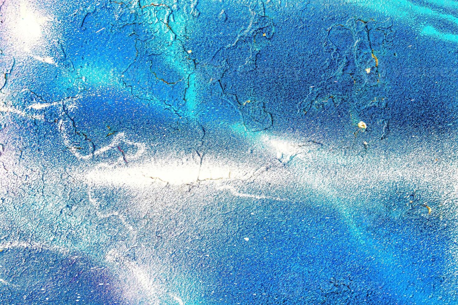 A fragment of colorful graffiti painted on a wall. Abstract urban background. photo