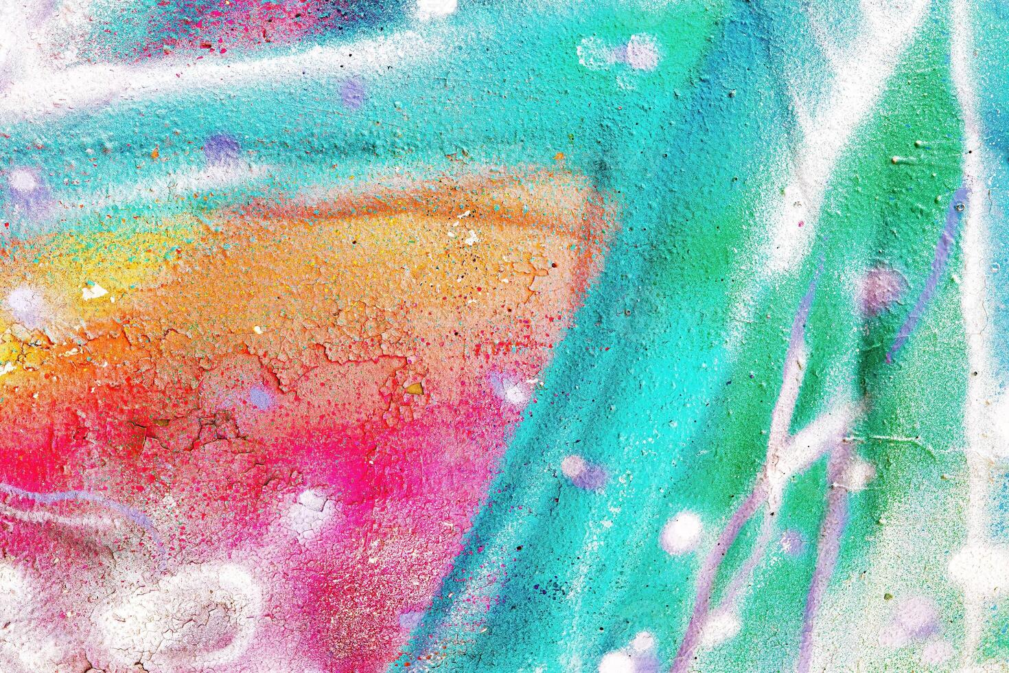 A fragment of colorful graffiti painted on a wall. Abstract urban background. photo