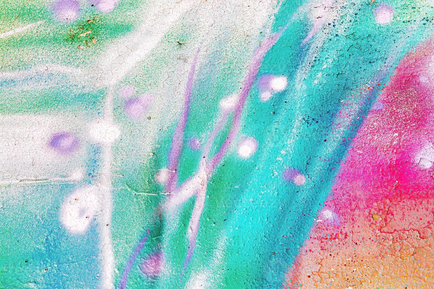 A fragment of colorful graffiti painted on a wall. Abstract urban background. photo