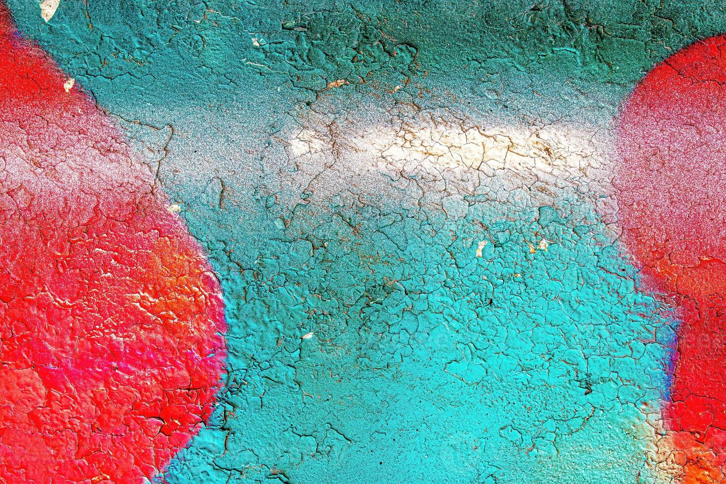 A fragment of colorful graffiti painted on a wall. Abstract urban background. photo