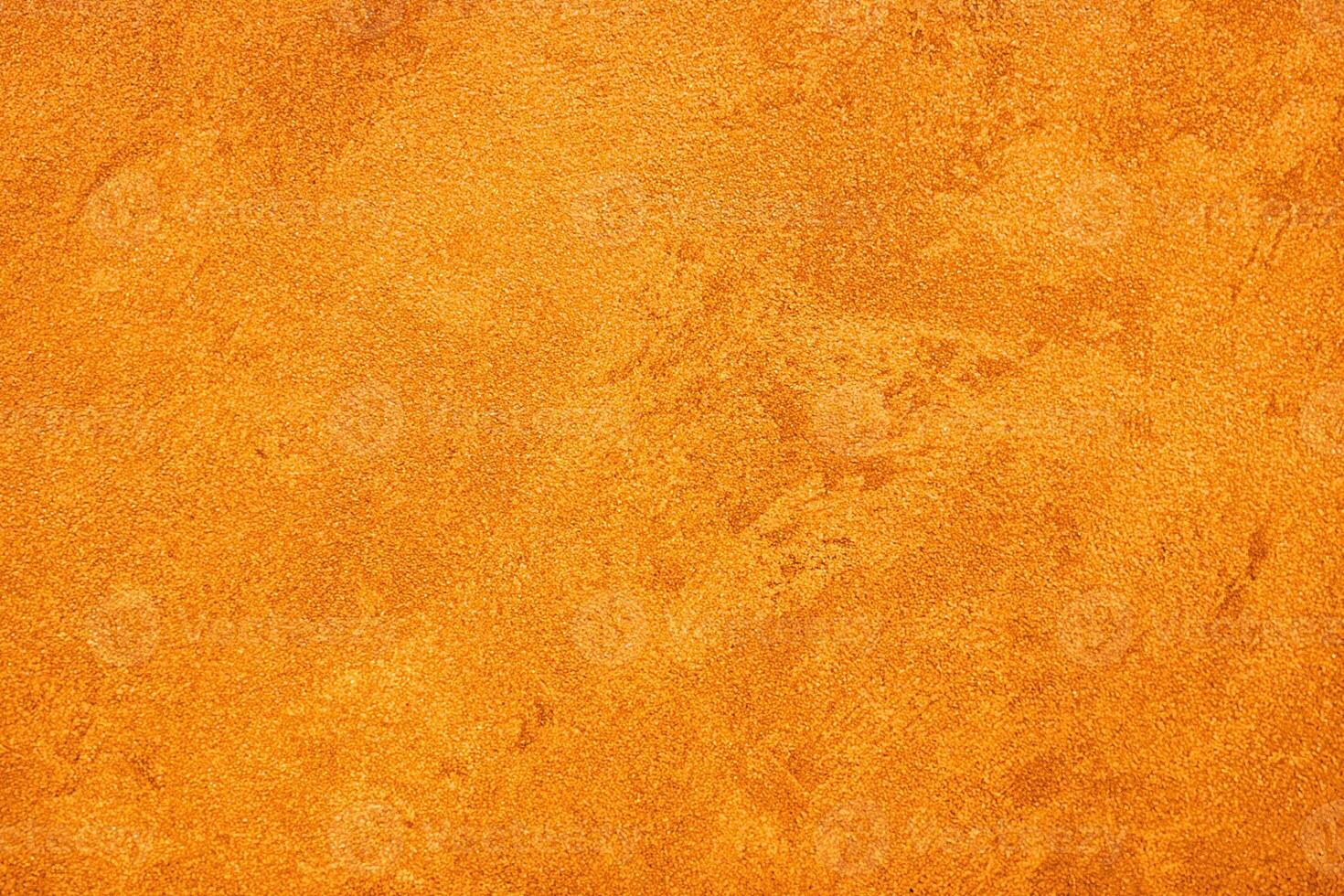 Texture of orange decorative plaster or concrete. Abstract grunge background. photo