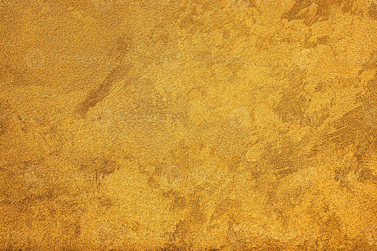 Texture of golden decorative plaster or concrete. Abstract grunge background. photo