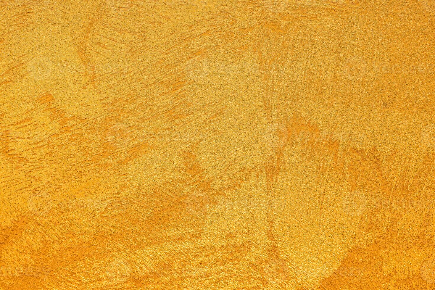 Texture of golden decorative plaster or concrete. Abstract grunge background. photo
