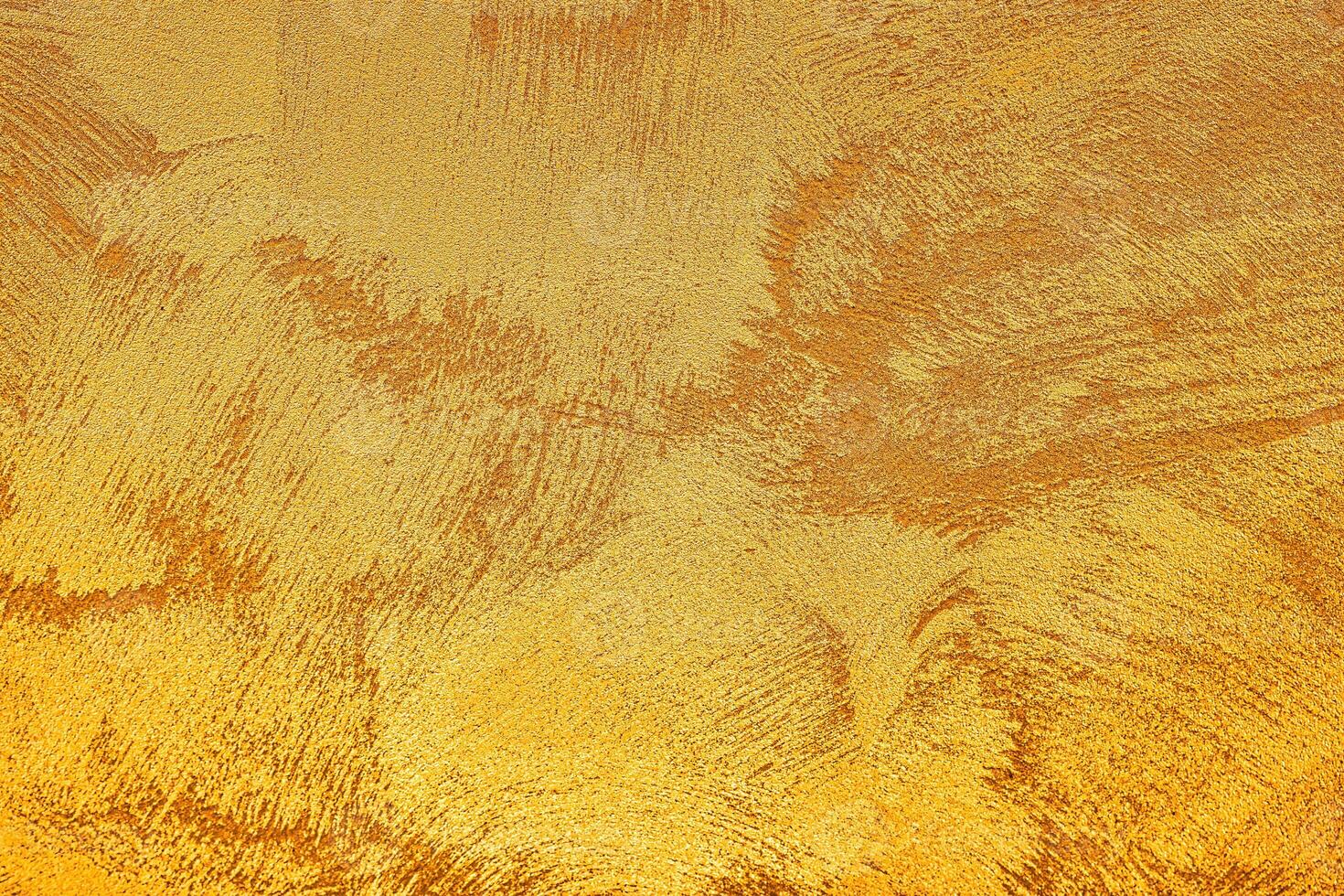 Texture of golden decorative plaster or concrete. Abstract grunge background. photo