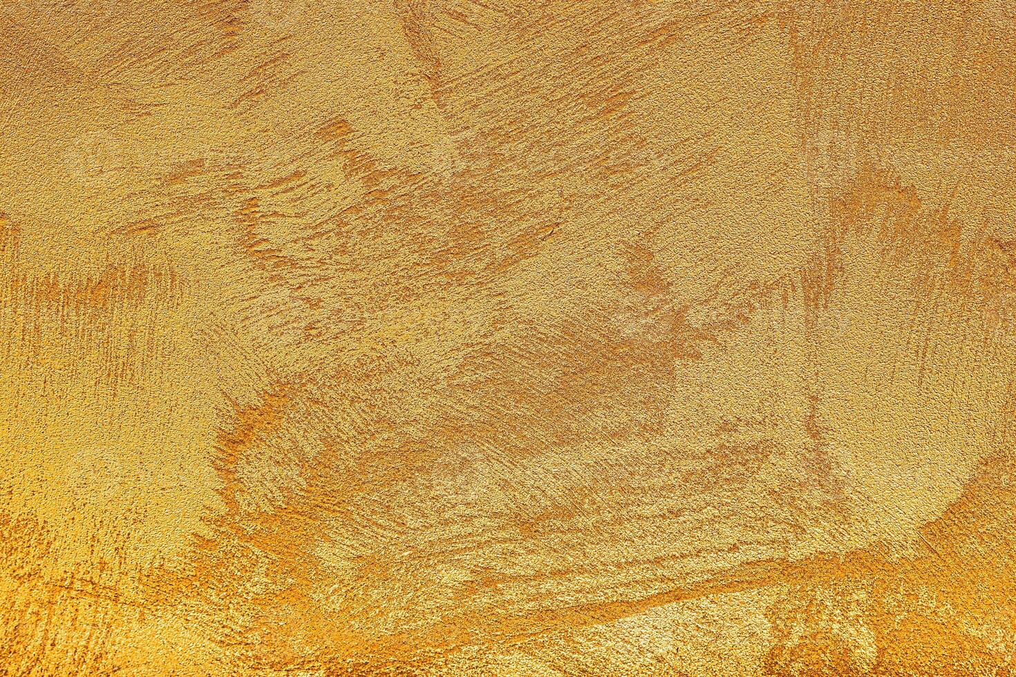 Texture of golden decorative plaster or concrete. Abstract grunge background. photo