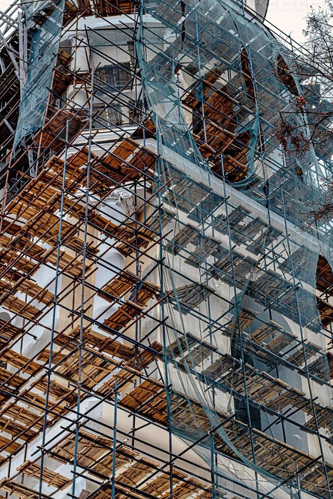Scaffolding without people on the reconstruction of a historic building. photo