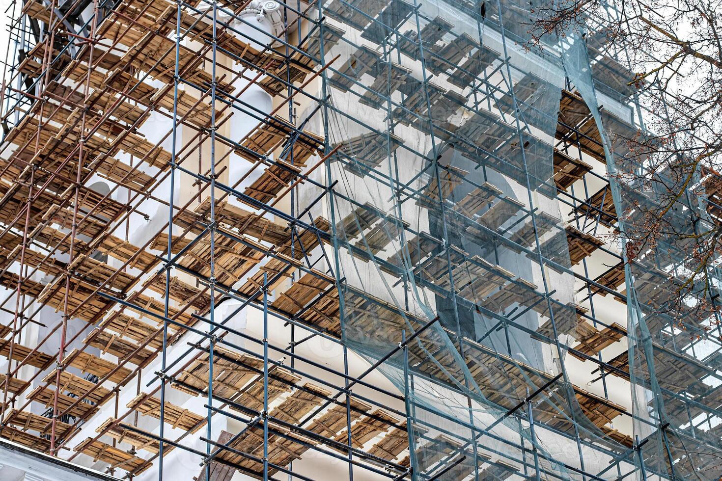 Scaffolding without people on the reconstruction of a historic building. photo