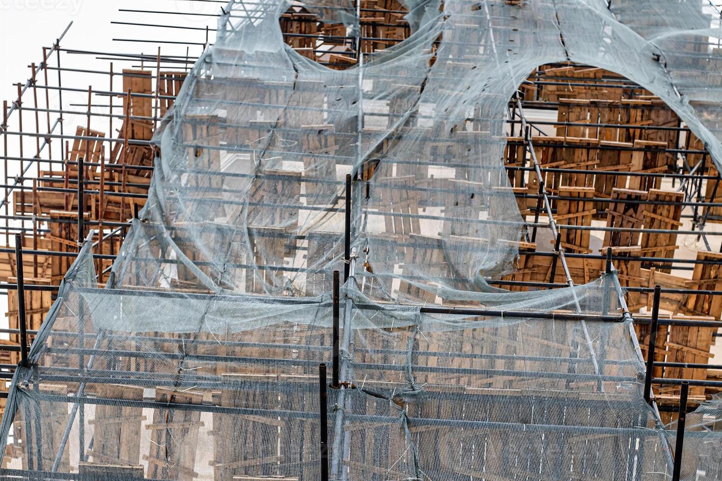 Scaffolding without people on the reconstruction of a historic building. photo