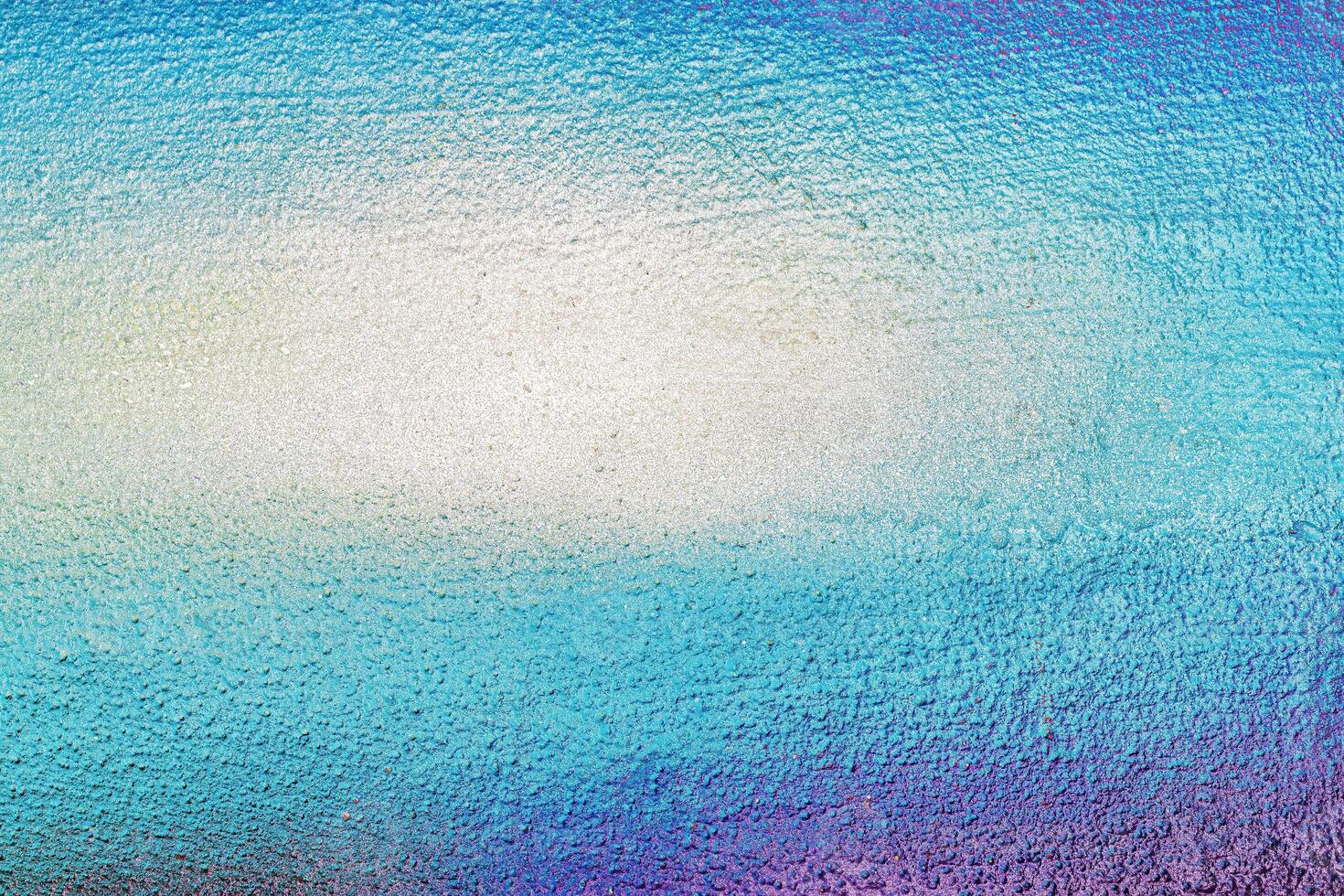 A fragment of colorful graffiti painted on a wall. Abstract urban background. photo