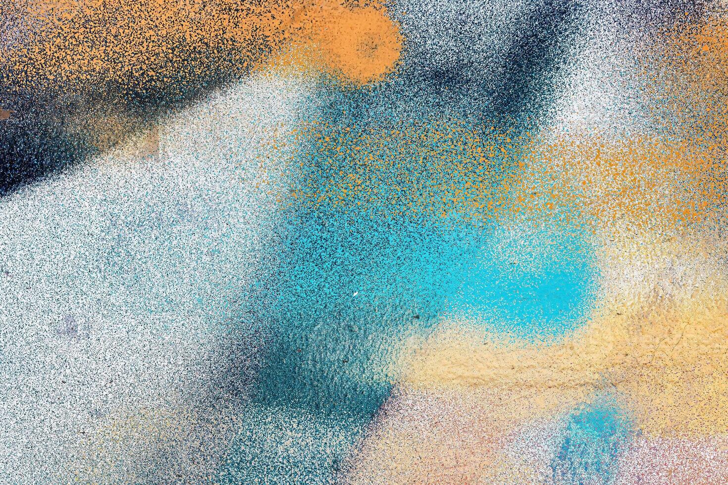 A fragment of colorful graffiti painted on a wall. Abstract urban background. photo